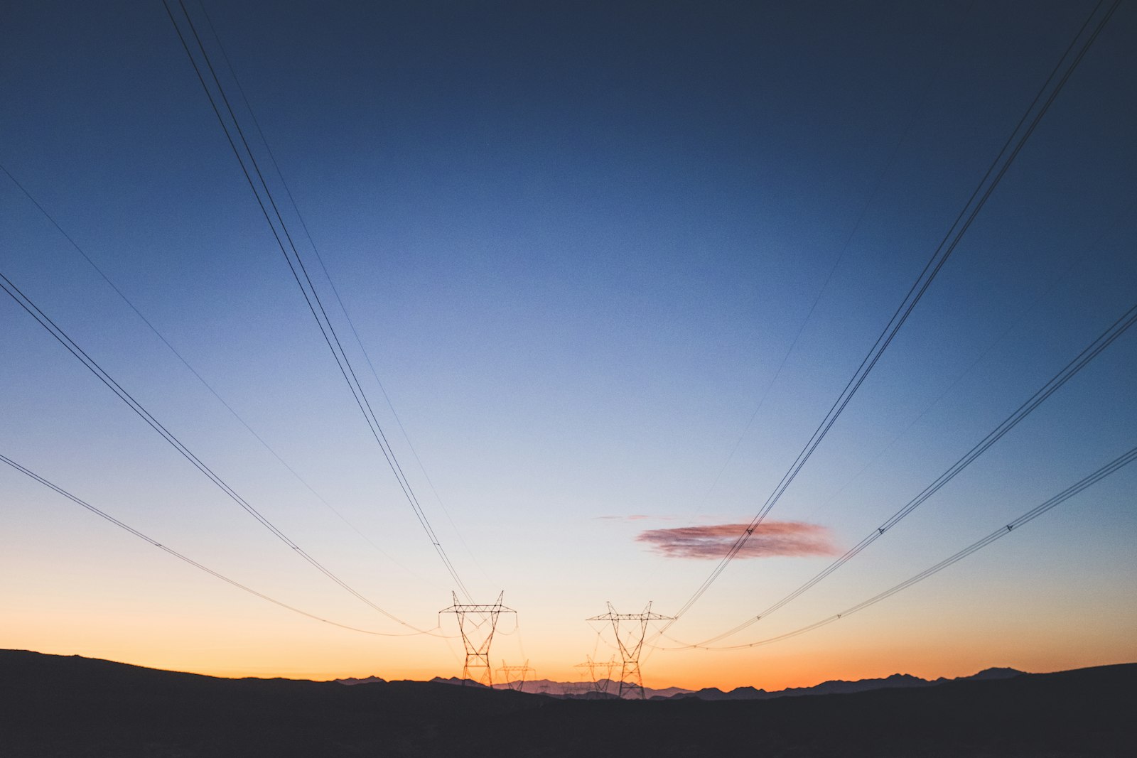 Electricity transmission towers at dusk
