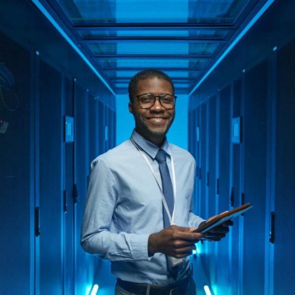 smiling-african-american-man-in-data-center.jpg smiling-african-american-man-in-data-center.jpg